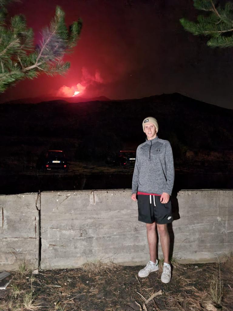 Kevin McGrath and an erupting Mt Etna, Sicily, in the background
