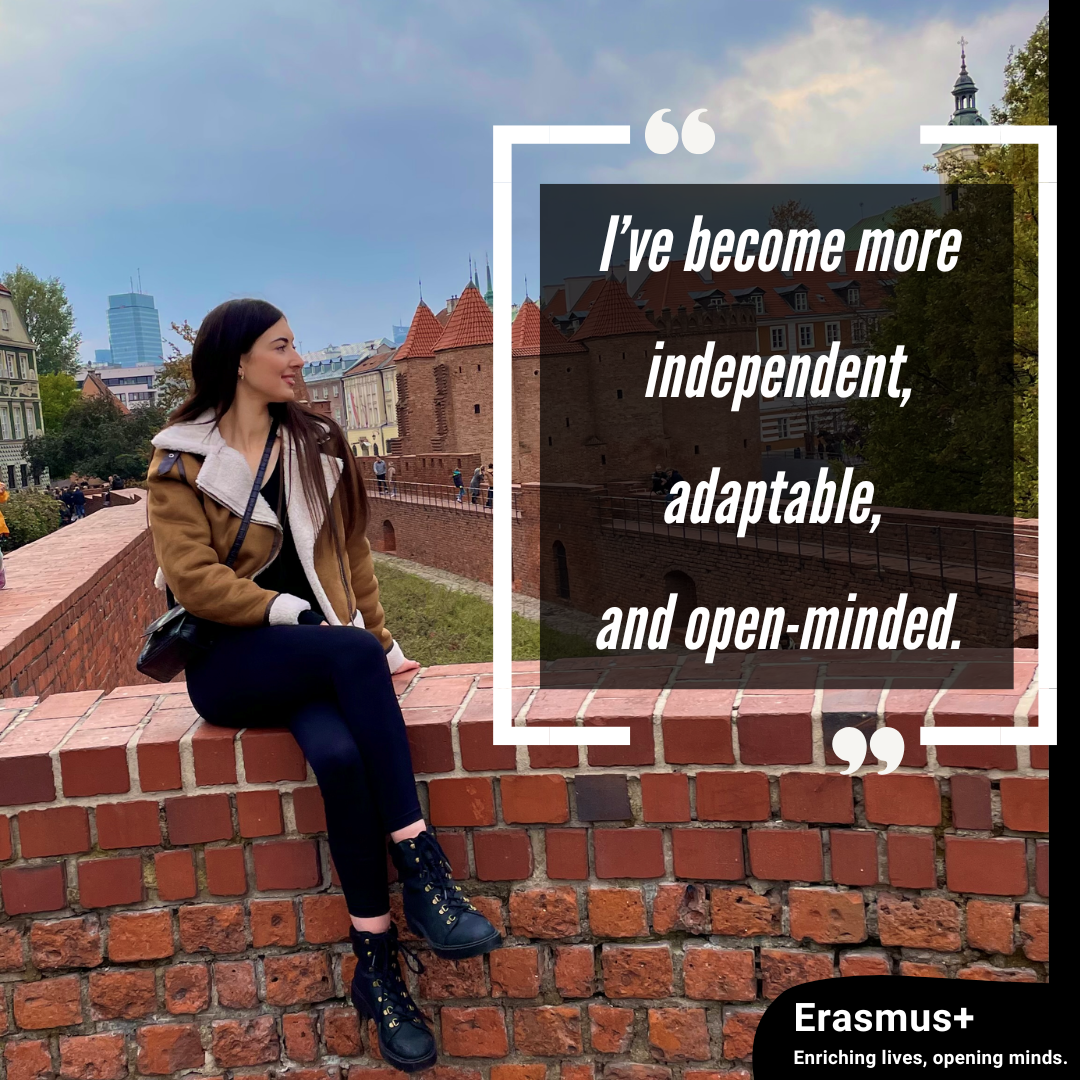 Liz Kennedy sitting on a wall in Poland during her erasmus